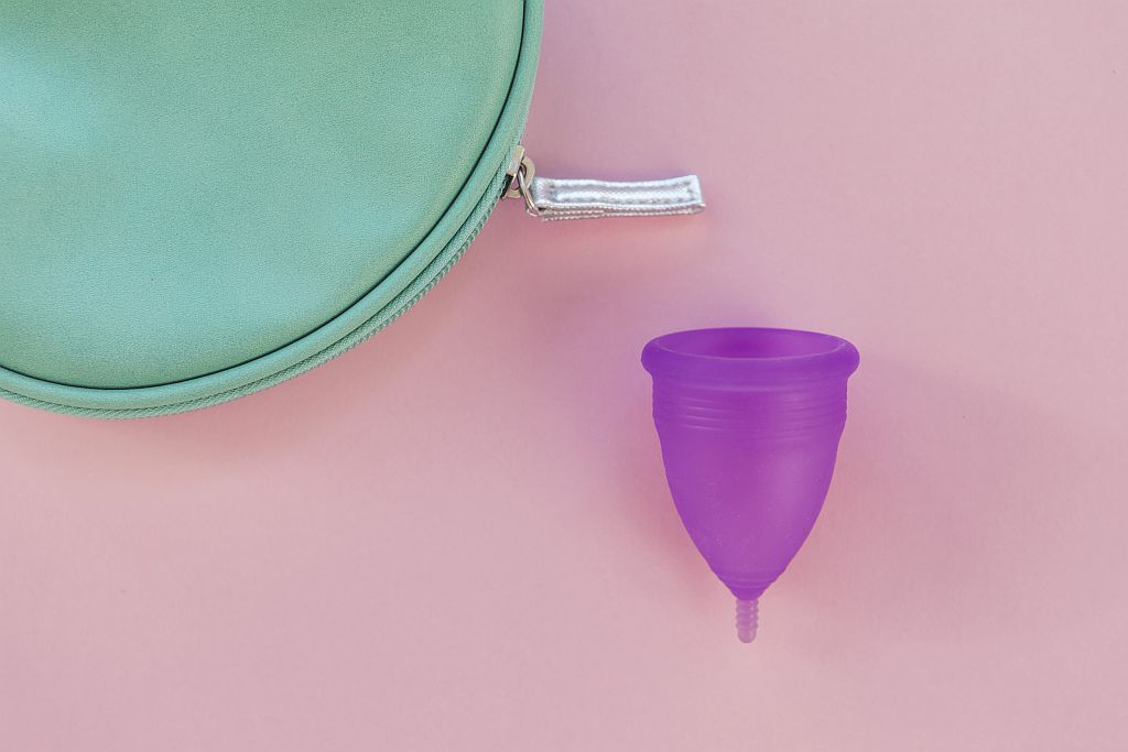 Menstrual cup as a reusable internal period product offering long-lasting, high-capacity protection during menstruation